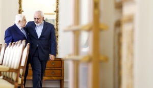 Iranian Foreign Minister Mohammad Javad Zarif (R) and his Syrian counterpart Walid al-Moualem walk before they start a meeting in Tehran August 5, 2015. Syrian Foreign Minister Walid al-Moualem arrived in Tehran on Tuesday for talks with officials from allies Iran and Russia that are expected to focus on efforts to end the civil war in his country. REUTERS/Raheb Homavandi/TIMA ATTENTION EDITORS - THIS PICTURE WAS PROVIDED BY A THIRD PARTY. REUTERS IS UNABLE TO INDEPENDENTLY VERIFY THE AUTHENTICITY, CONTENT, LOCATION OR DATE OF THIS IMAGE. FOR EDITORIAL USE ONLY. NOT FOR SALE FOR MARKETING OR ADVERTISING CAMPAIGNS. NO THIRD PARTY SALES. NOT FOR USE BY REUTERS THIRD PARTY DISTRIBUTORS. THIS PICTURE IS DISTRIBUTED EXACTLY AS RECEIVED BY REUTERS, AS A SERVICE TO CLIENTS - RTX1N408